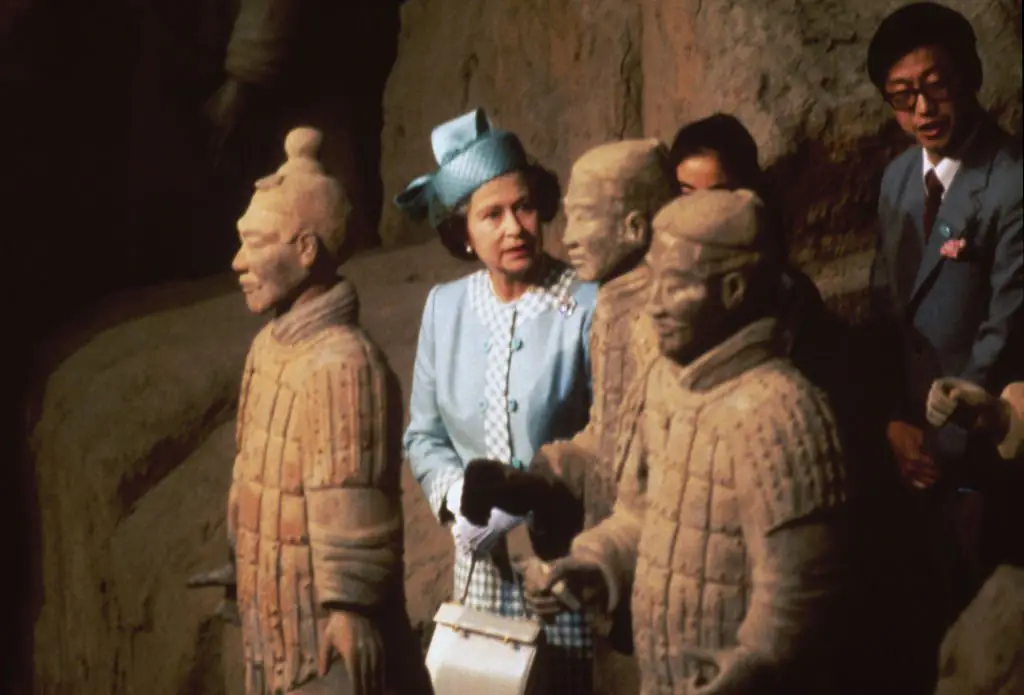 Queen Elizabeth II viewing some of the Terracotta Army soldier statues at the Mausoleum of the First Qin Emperor during a state visit to the People's Republic Of China in 1986. Credit: Fox Photos / Hulton Archive / Getty