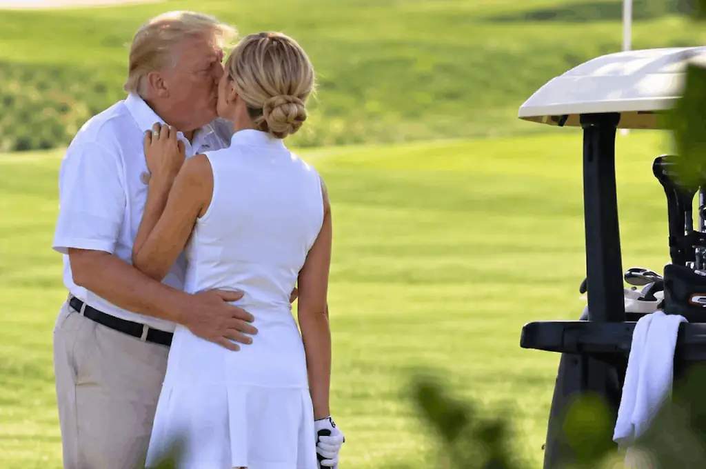 The image of Trump kissing a blonde woman was described as 'clearly a fake photo' by the White House. Credit: X