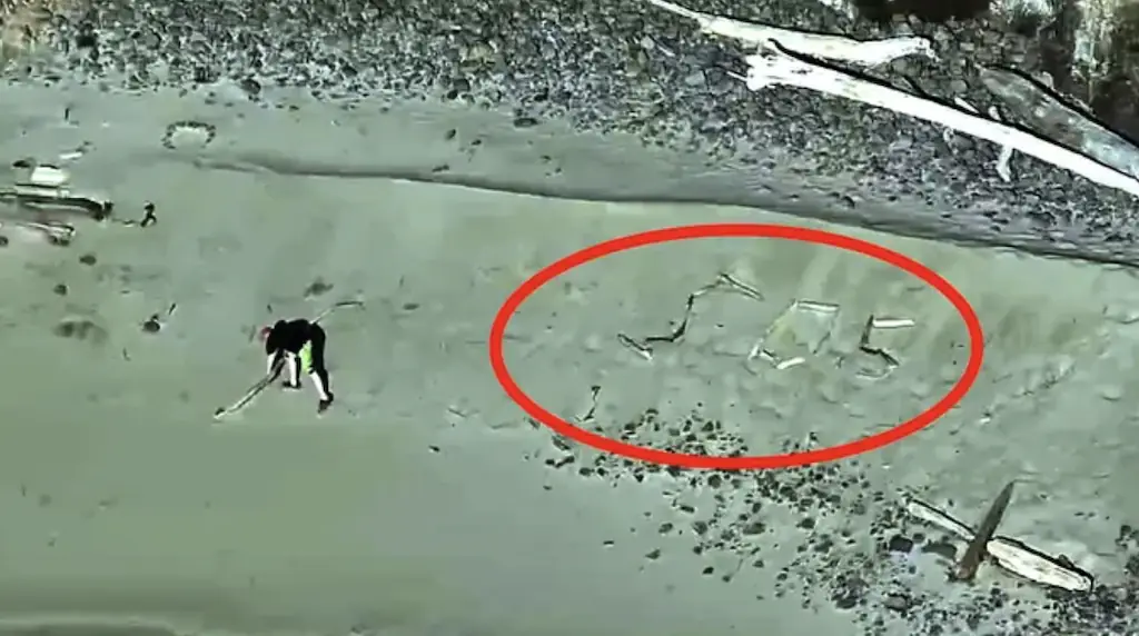 The trio spelled out SOS in sticks. Credit: Netarts-Oceanside Fire District