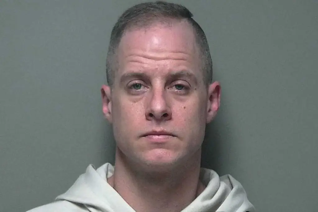 Caleb Flynn is accused of killing his wife, Ashley Flynn, and staging the crime scene in their Ohio home. Credit: Miami County Jail