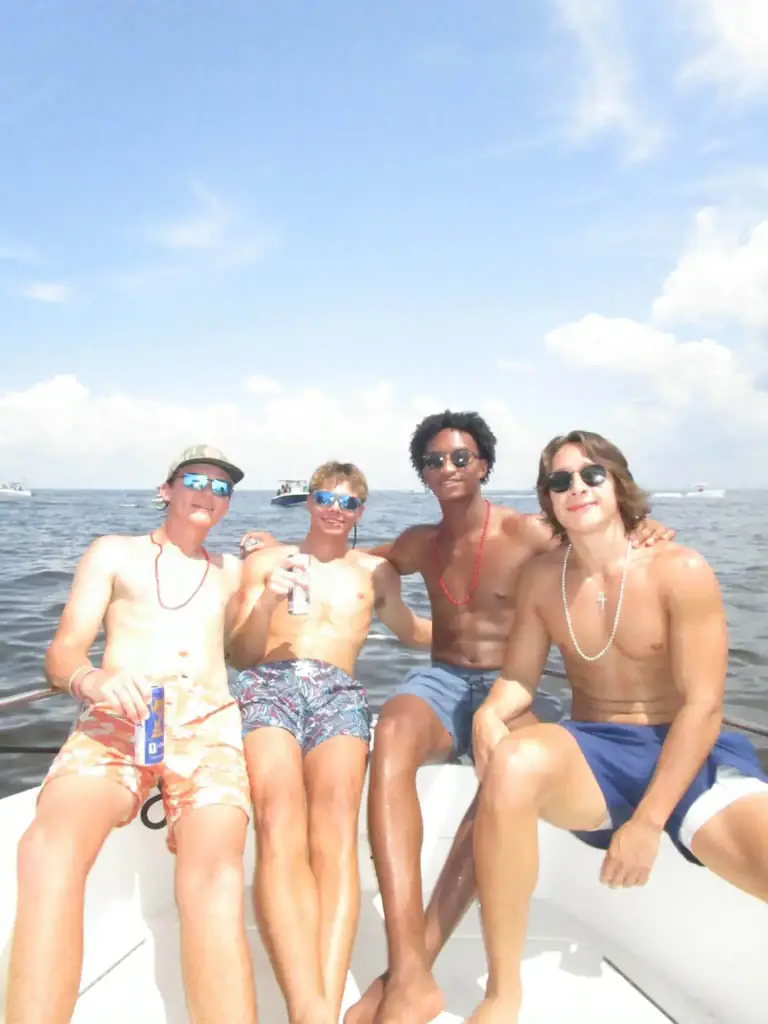 Wells with friends on a boat during July 4 celebrations. Credit: Facebook